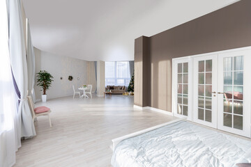 Luxurious and expensive interior of an open-plan apartment in light colors. Stylish modern bedroom with minimal design, dining area and guest space.