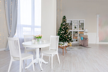 Luxurious and expensive interior of an open-plan apartment in light colors. Stylish modern bedroom with minimal design, dining area and guest space.