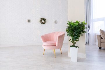 Luxurious and expensive interior of an open-plan apartment in light colors. Stylish modern bedroom with minimal design, dining area and guest space.