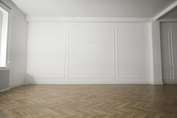 Parquet floor in light spacious empty room