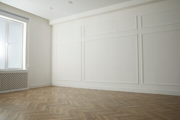 Parquet floor in light spacious empty room