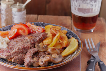 Pan fried beef steak with chips.