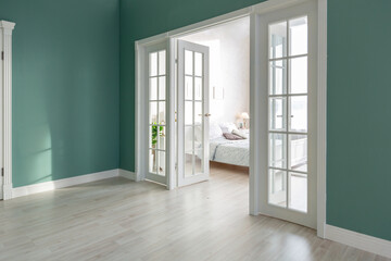 Luxurious and expensive interior of an open-plan apartment in light colors. Stylish modern bedroom with minimal design, dining area and guest space.