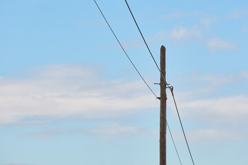 An old phone or electricity pole made of wood