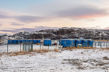 Shift camp in the Arctic, houses on the shore of the Barents sea. Teriberka. Russia.