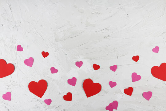 Valentine's Day Red And Pink Paper Hearts Of Various Sizes On Light Concrete Background Flat Lat Composition Mokup Ready