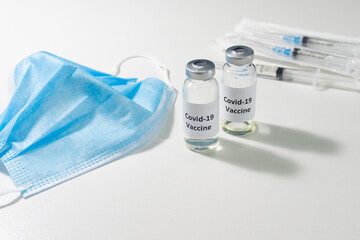 Vials with the covid-19 vaccine. Vaccination of the population against coronovirus.