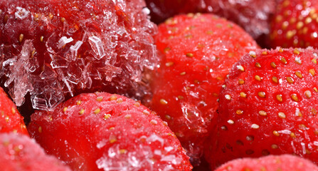 Frozen strawberry with ice crystals macro photography