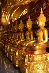 Fototapeta premium Golden statue of buddha in temple, Thailand 