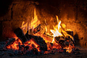 A fire burns in a fireplace, Fire to keep warm