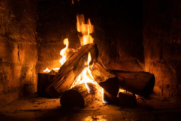 A fire burns in a fireplace, Fire to keep warm