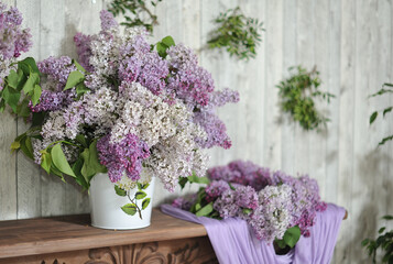 Large bouquet with blooming lilacs in the home interior