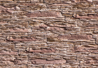 finely structured surface with flat stones in sand color