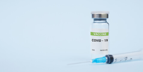 Vaccine against coronavirus, covid-19 concept. on a blue background. copy space, banner