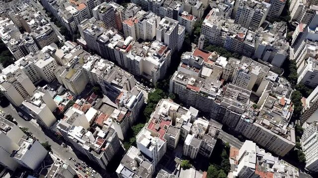 Top view aerial Drone footage of Copacabana beach buildings on a sunny day in Rio de Janeiro, Brazil. City and Urban scene.
