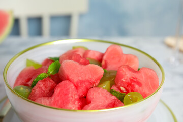 Delicious salad with watermelon in bowl, closeup