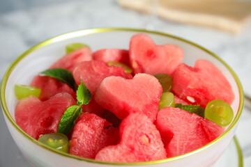 Delicious salad with watermelon in bowl, closeup