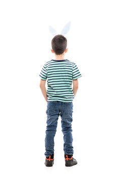 Cool Confident Young Boy With Easter Bunny Ears And Hands In Pockets Looking Away Watching Copy Space. Full Length Isolated On White Background.