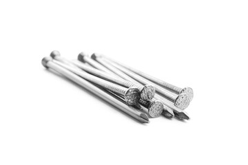 Pile of metal nails on white background