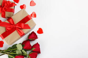 Gift boxes, roses and hearts on white background, flat lay with space for text. Valentine's Day celebration