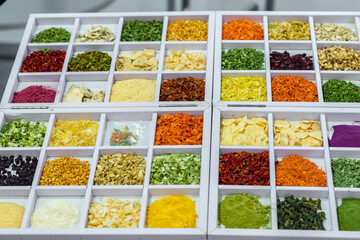 Dried vegetables in wooden box, onions, beets, carrots, pumpkin, bay leaf. Superfoods, herbs.