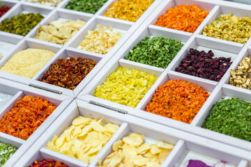 Dried vegetables in wooden box, onions, beets, carrots, pumpkin, bay leaf. Superfoods, herbs.