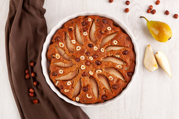 Delicious pear cake on a wooden table.