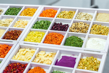 Dried vegetables in wooden box, onions, beets, carrots, pumpkin, bay leaf. Superfoods, herbs.