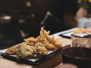 Serving of tempura prawns and vegetables