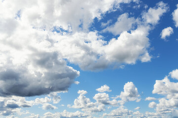 White clouds cumulus floating on blue sky for backgrounds concept