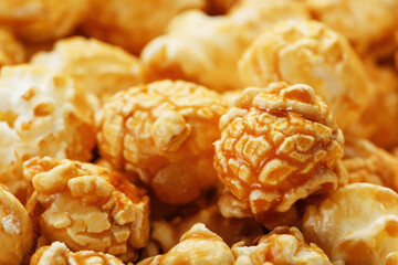 Popcorn in caramel glaze macro as a background.
