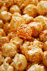 Popcorn in caramel glaze macro as a background.
