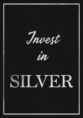 A silver leaf and black leather effect INVEST IN SILVER phrase typographical graphic illustration with black leather background