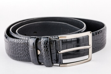 Leather belt for men, black leather belt on white background, elegant leather belt