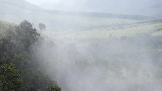 Static time-lapse shot of mist drifting away from Lisbon falls. Filmed right after a big rain storm. Filmed with a Canon 200D on a Tripod.