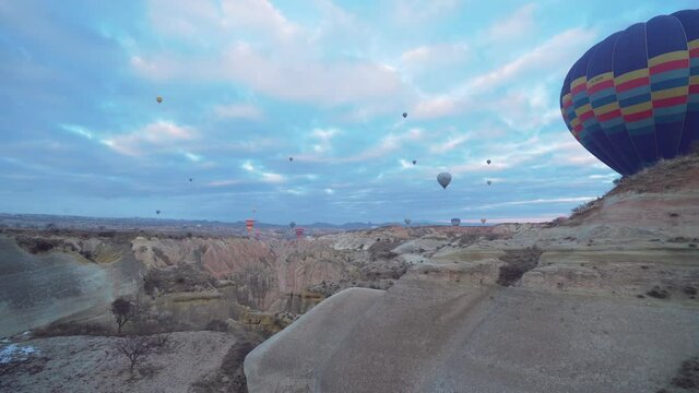 Aerial view of fairy chimneys. Flight hot air balloons in Cappadocia. 4K Footage