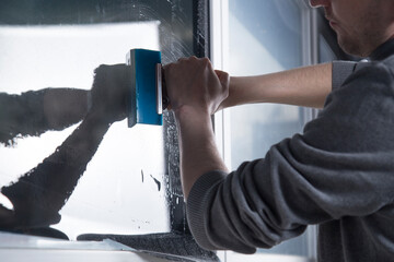 Installation of window film in the office. Protection from ultraviolet radiation.