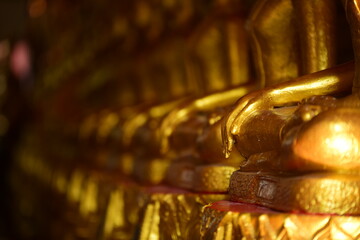 The golden Buddha image. Reverence in Buddhist sutras At Wat Luang Pothit, Thailand