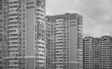 Fototapeta na wymiar Panel high-rise apartment building exterior in Russia black and white