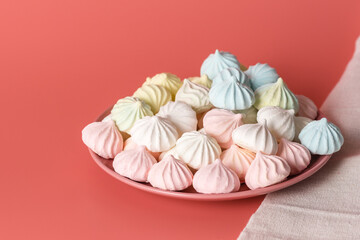 Sugar protein dessert in pastel colors in a pink plate on pink background. Linen napkin. Close-up