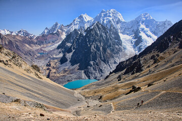 Trekker descending Santa Rosa Pass on the Cordillera Huayhuash circuit, Ancash, Peru