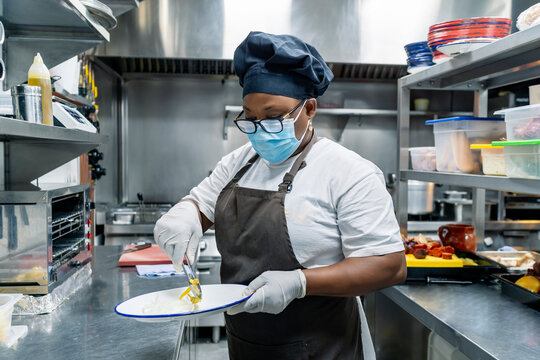 cook preparing the dishes on the menu