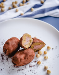 Filled cutaway potato cake on a plate with hazelnuts