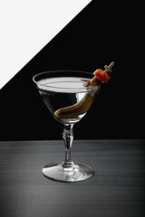 Cocktail with pickle, carrot and olive