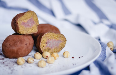 Filled cutaway potato cake on a plate with hazelnuts