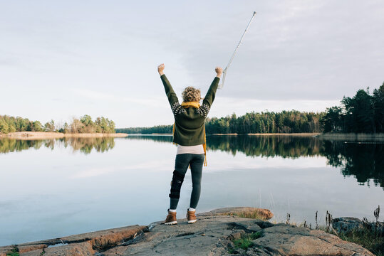 Injured Woman Celebrating Walking By The Coast In Sweden