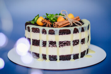 Christmas chocolate naked cake with butter cream on blue background