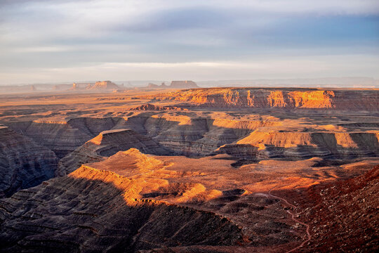 sunrise over the San Juan River, Monument Valley in the distance, Utah