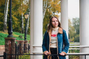 Young girl with long hair on the city embankment