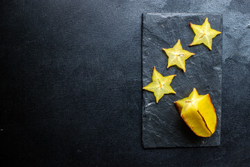 carambola star fruit slices ready to eat healthy snack outdoor top view copy space for text food...